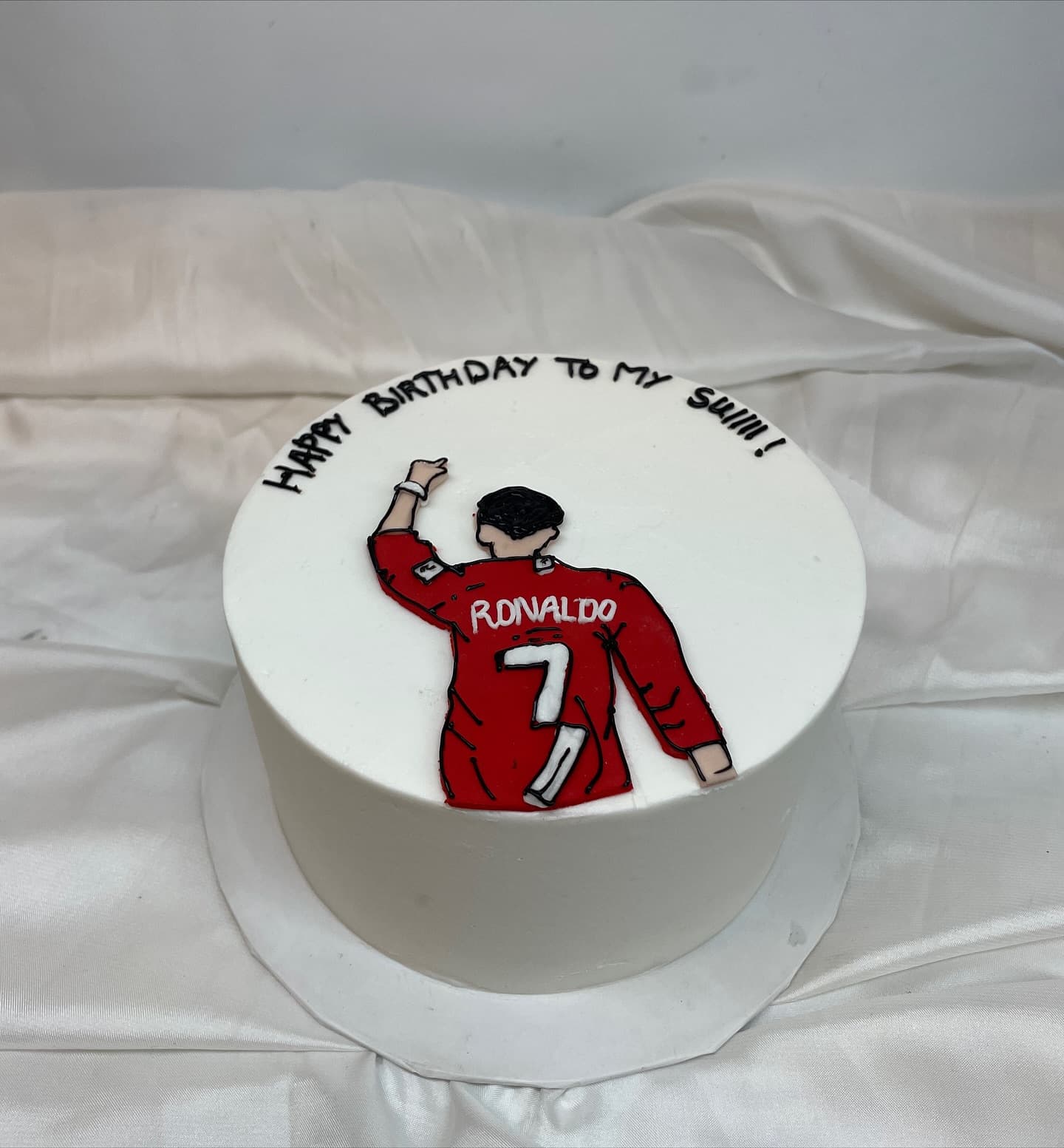 Football cake themed on Ronaldo's siu celebration